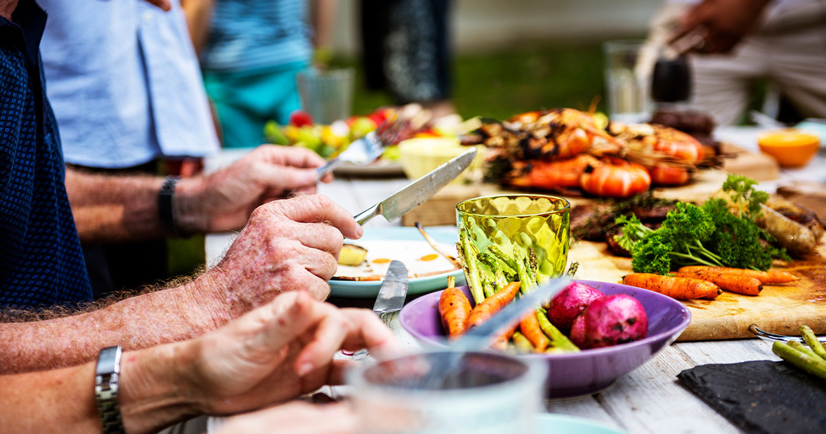 Plates of food at an outdoor dinner party